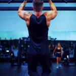 man in black t-shirt and black pants doing exercise
