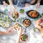 people holding clear drinking glasses