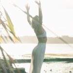woman standing near body of water