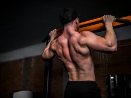 근육 건강, 일상 속 작은 변화로 지키는 법 topless man in black shorts holding orange bar
