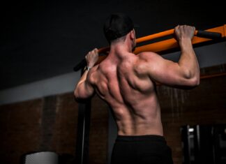 근육 건강, 일상 속 작은 변화로 지키는 법 topless man in black shorts holding orange bar