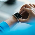 “우리 손목 속의 건강 동반자, 웨어러블 데이터로 한 걸음 더 좋은 삶으로” person clicking Apple Watch smartwatch